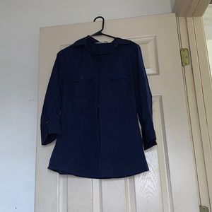 Medium dark blue button up blouse with gold accent on the buttons